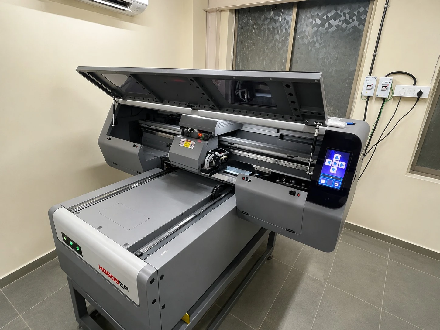 Team operating a CNC laser cutting machine