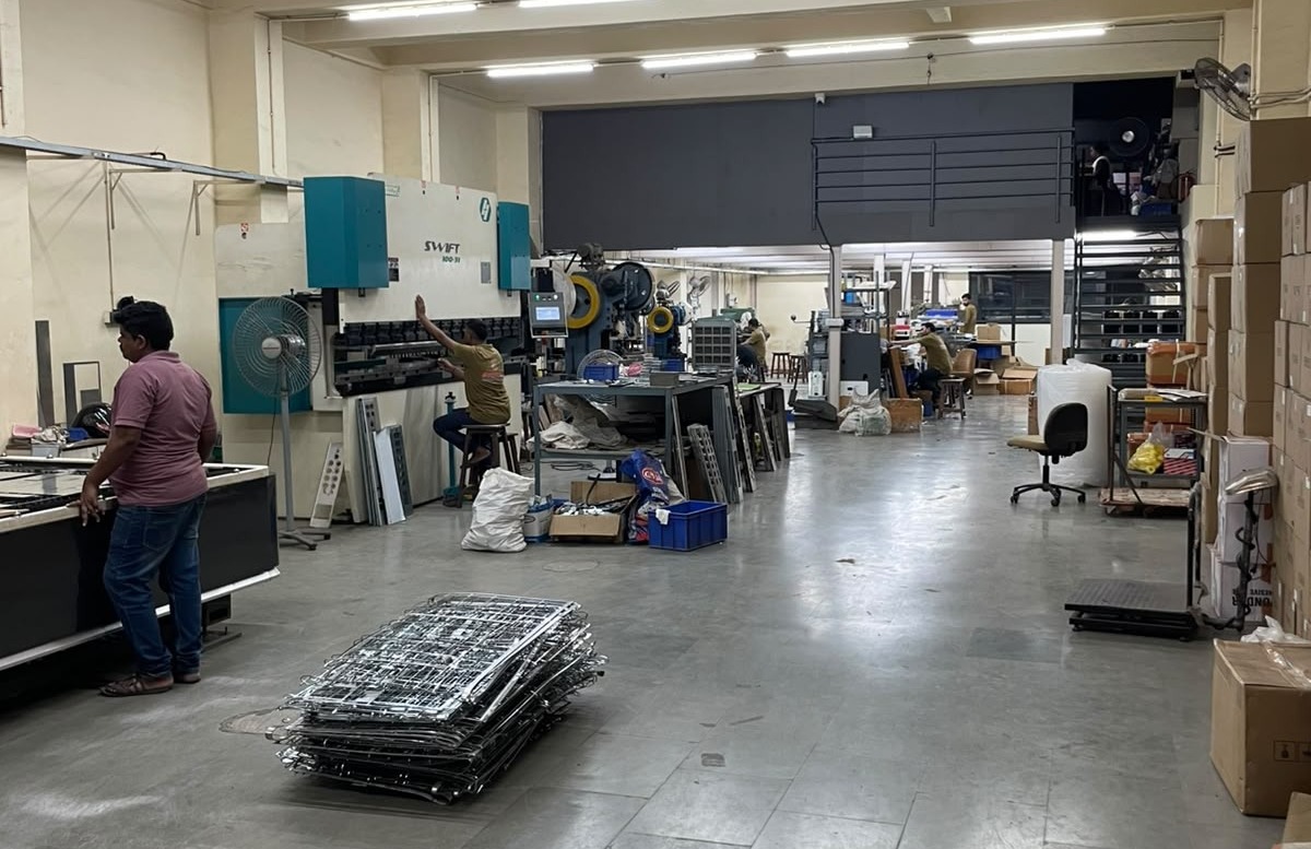 Laser cutting machine working on elevator component sheets